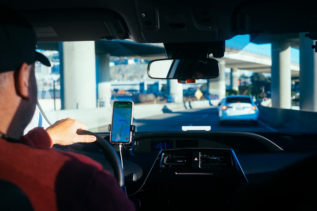 Gig car rental driver in a vehicle during the application and pickup process