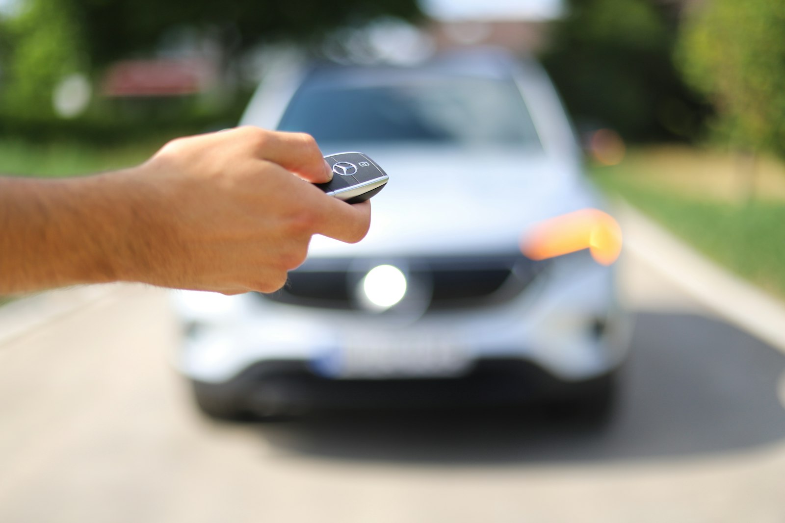 driver using a phone during a car rental application and screening process