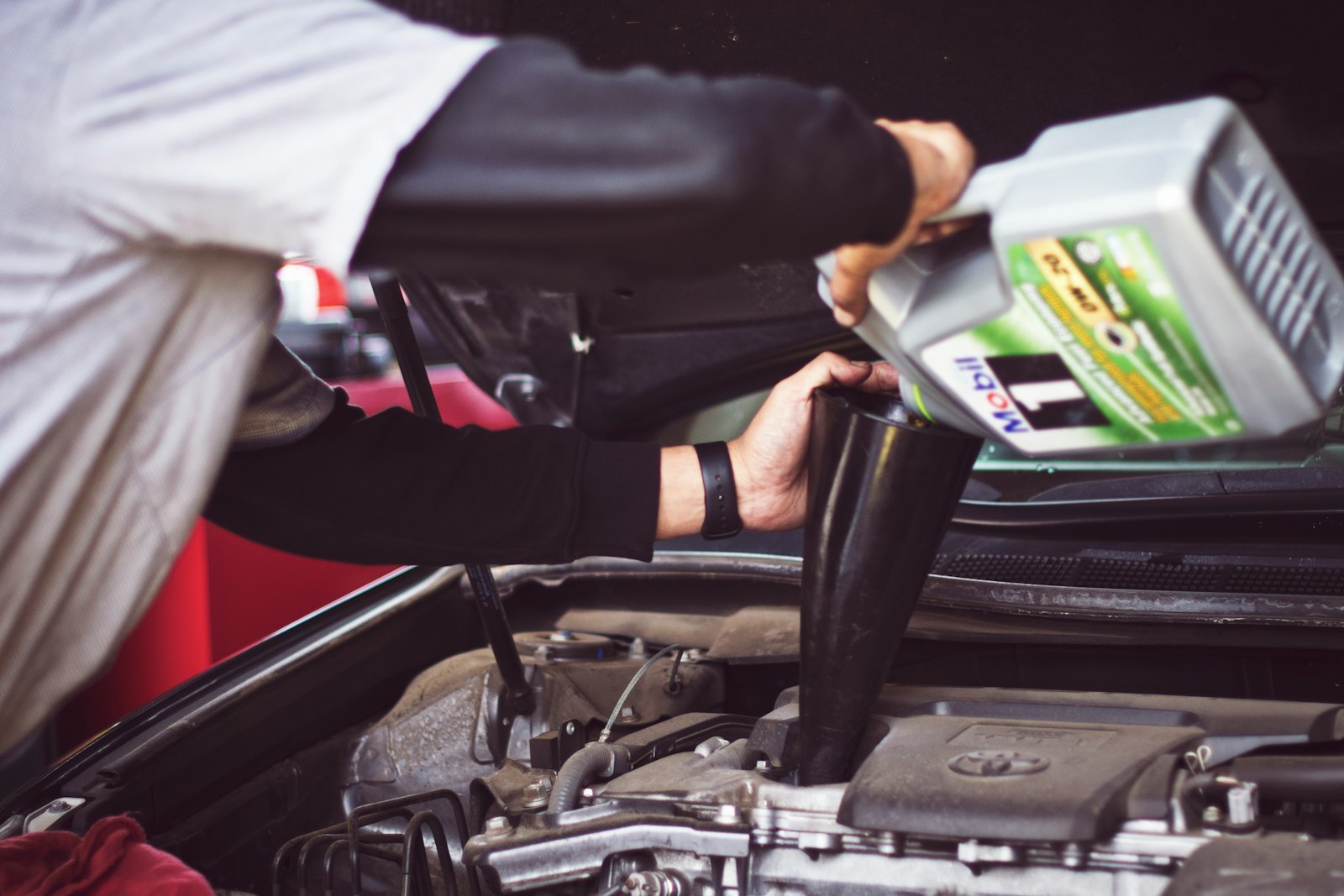 mechanic repairing a vehicle to reduce gig rental downtime