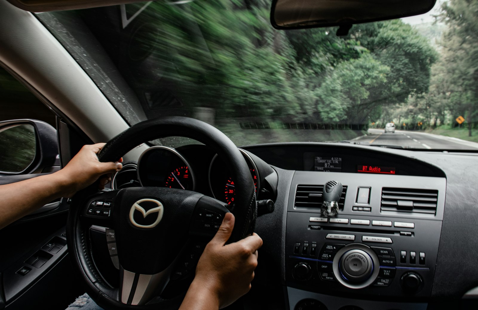 driver behind the wheel representing a responsible long-term gig car renter