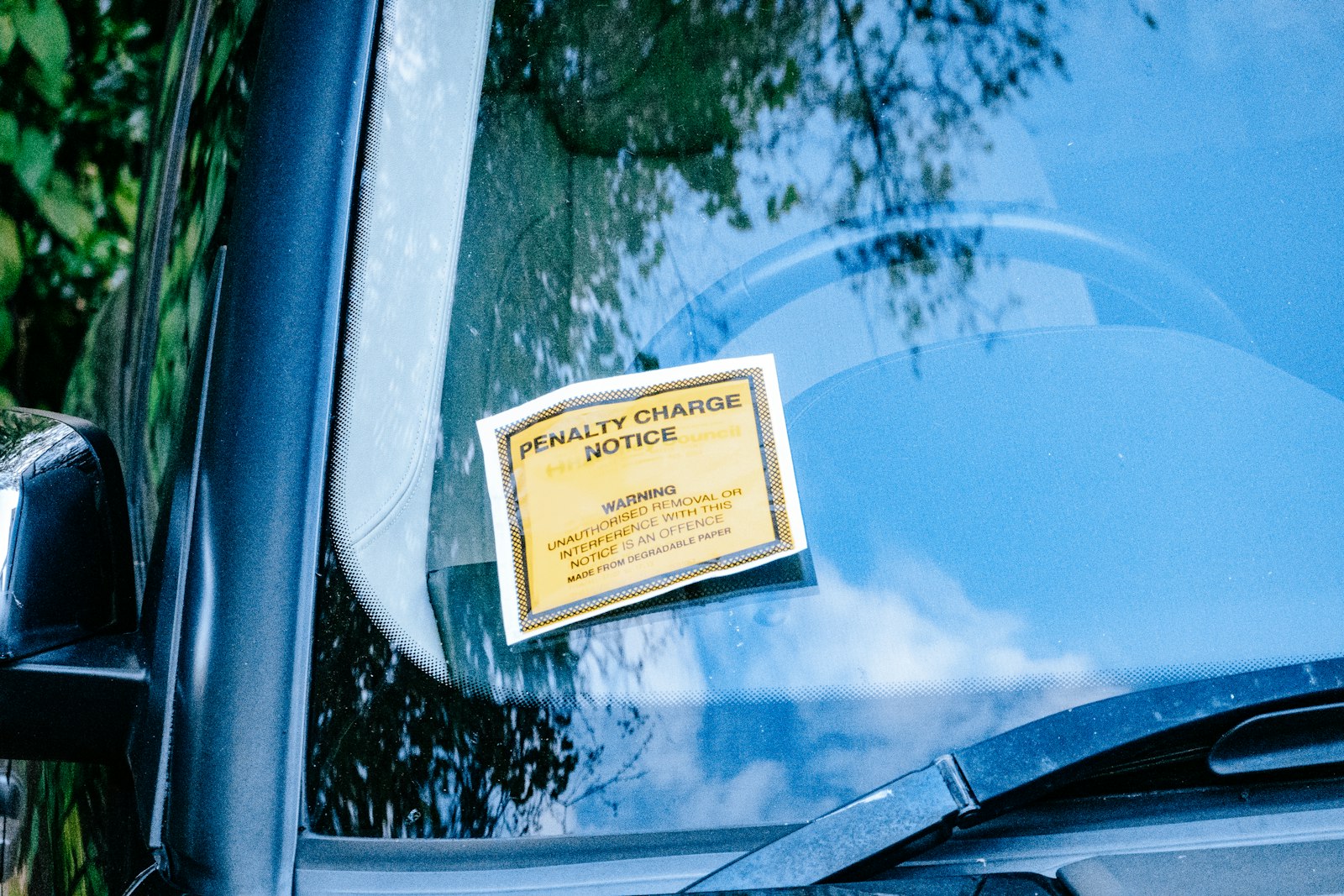 vehicle window sign representing eligibility checks for a rideshare rental