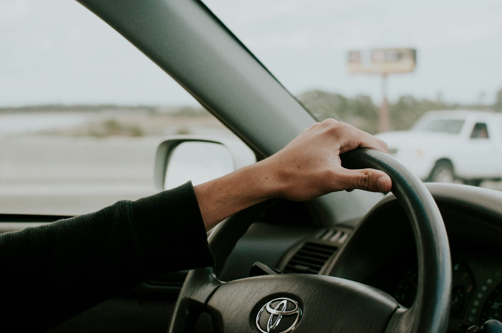 driver in a car representing rideshare rental checks before pickup