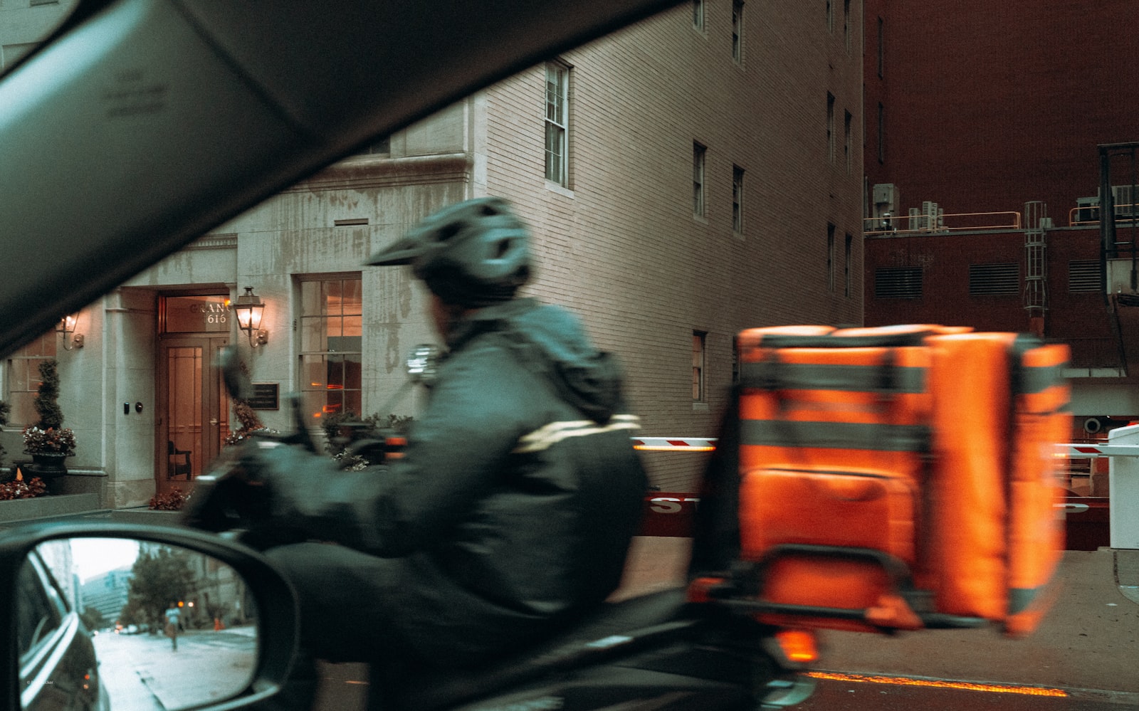 food delivery worker carrying an insulated delivery bag
