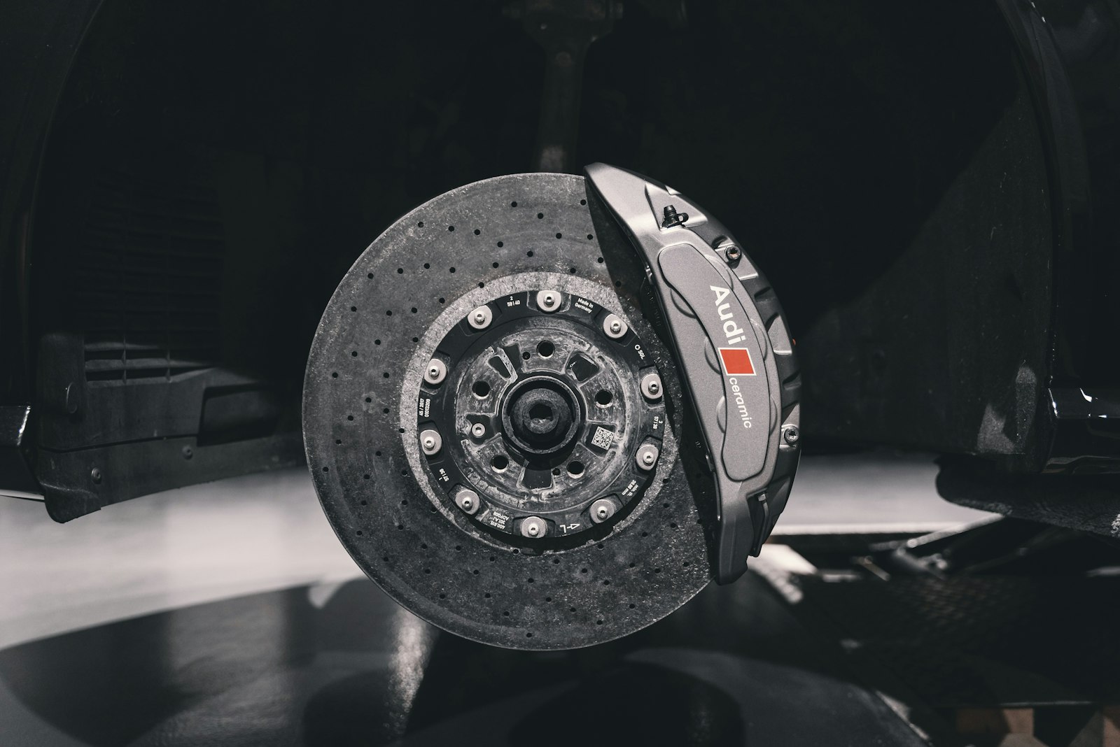 close-up automotive brake representing wear on a high-mileage gig rental