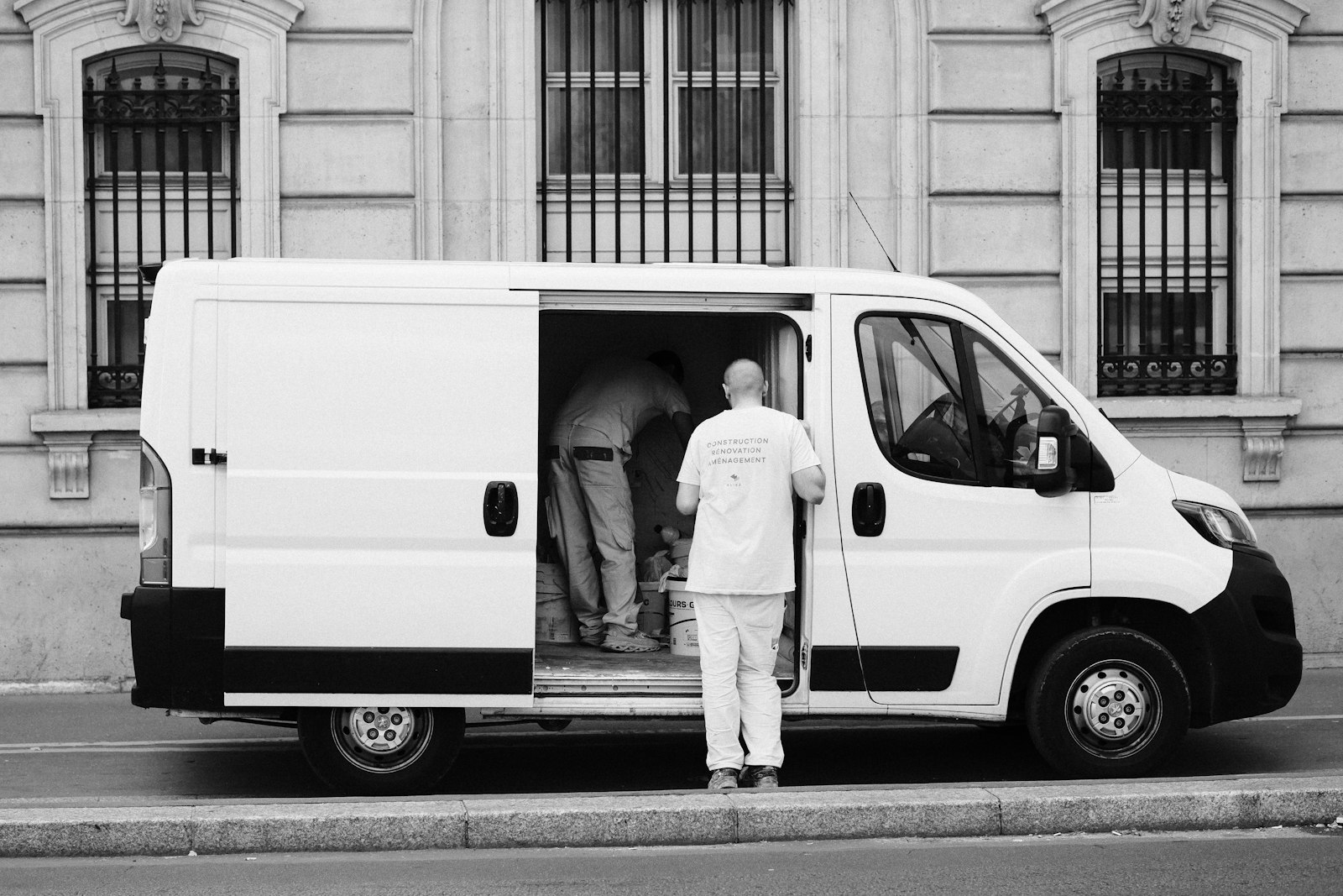 delivery driver beside a van representing multi-app delivery work
