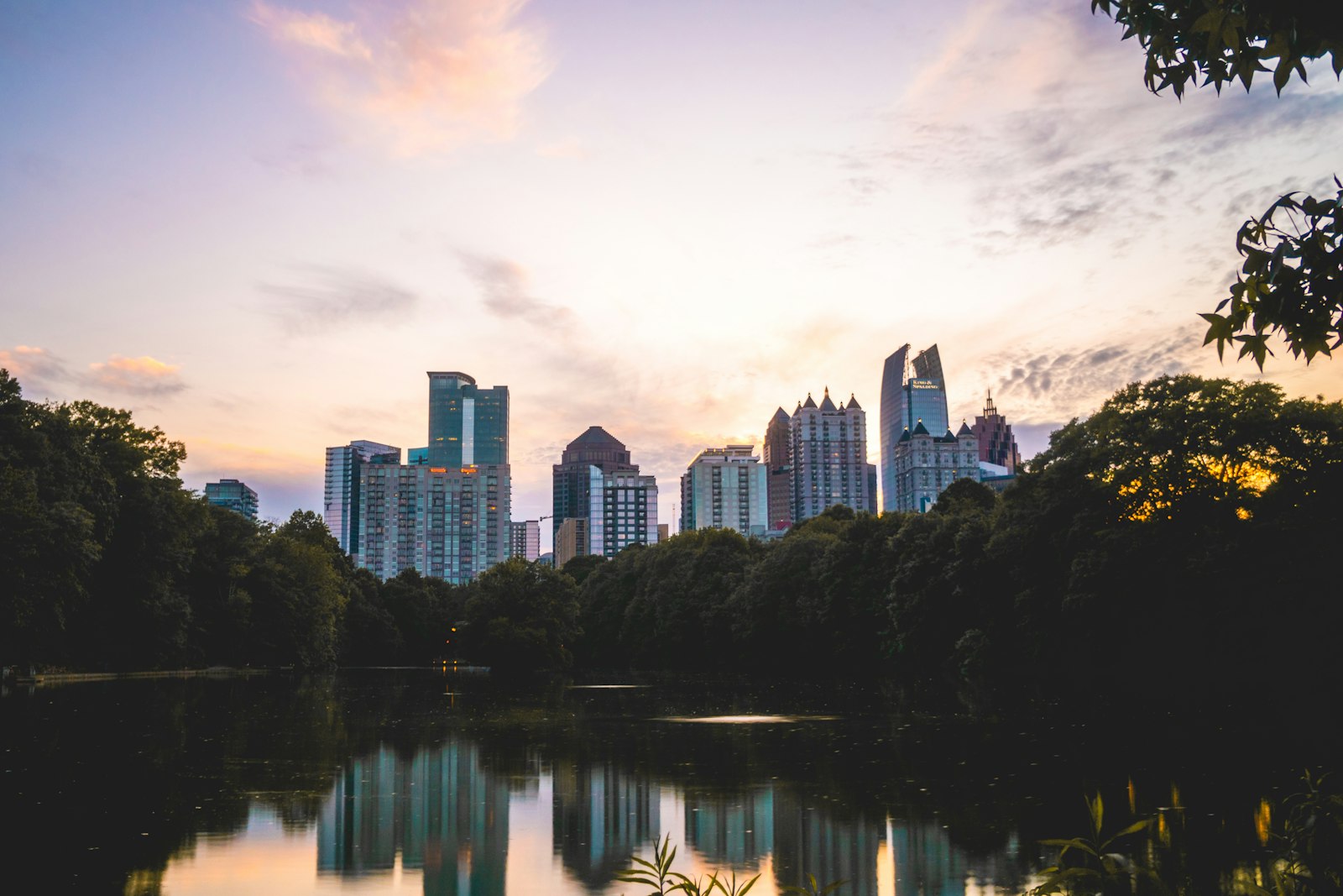 Atlanta park skyline at sunset representing Newnan and Coweta gig rental access